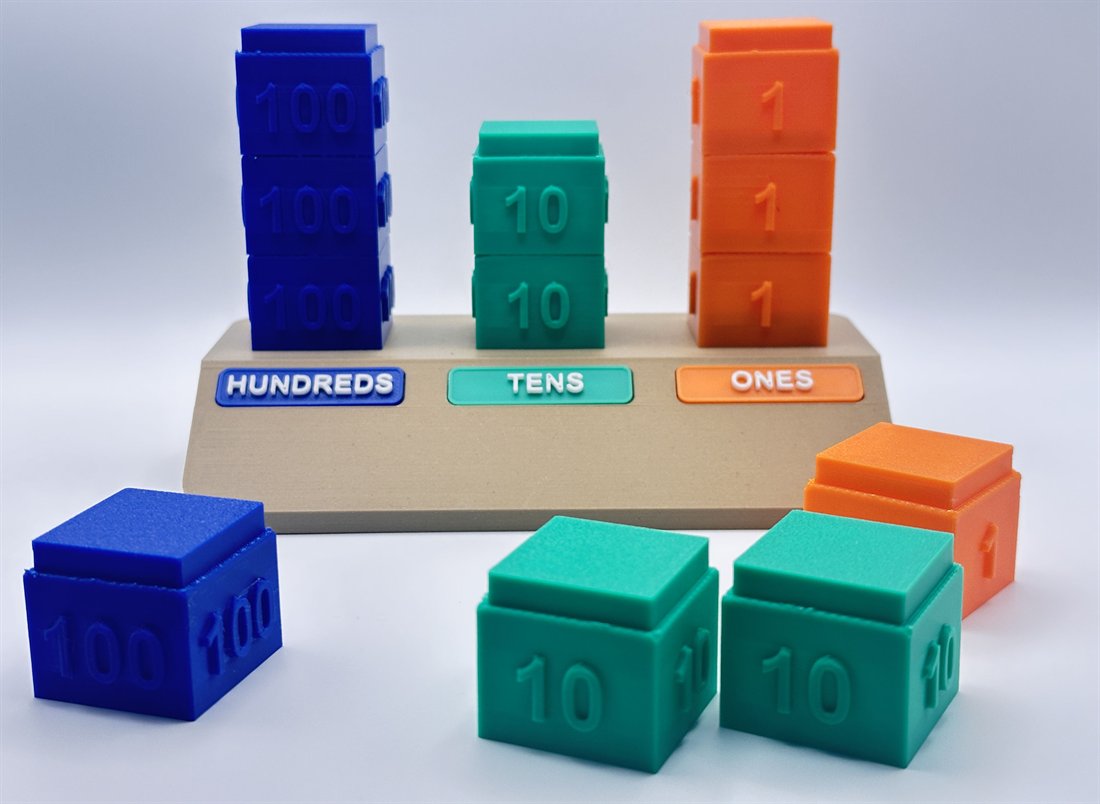 Stacking place-value blocks for hundreds, tens, and ones
